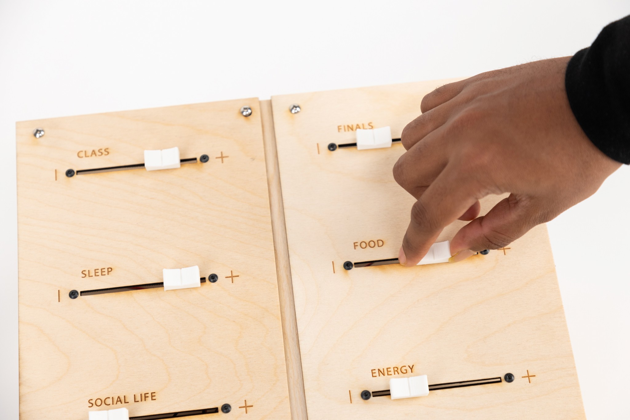 Participant moving a slider on the finished Shuffle installation